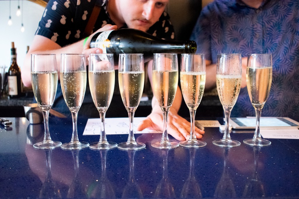 Champagne pouring at A Presto Italian Foods' Pop-up Dinner Event | Washington, DC Event Photographer